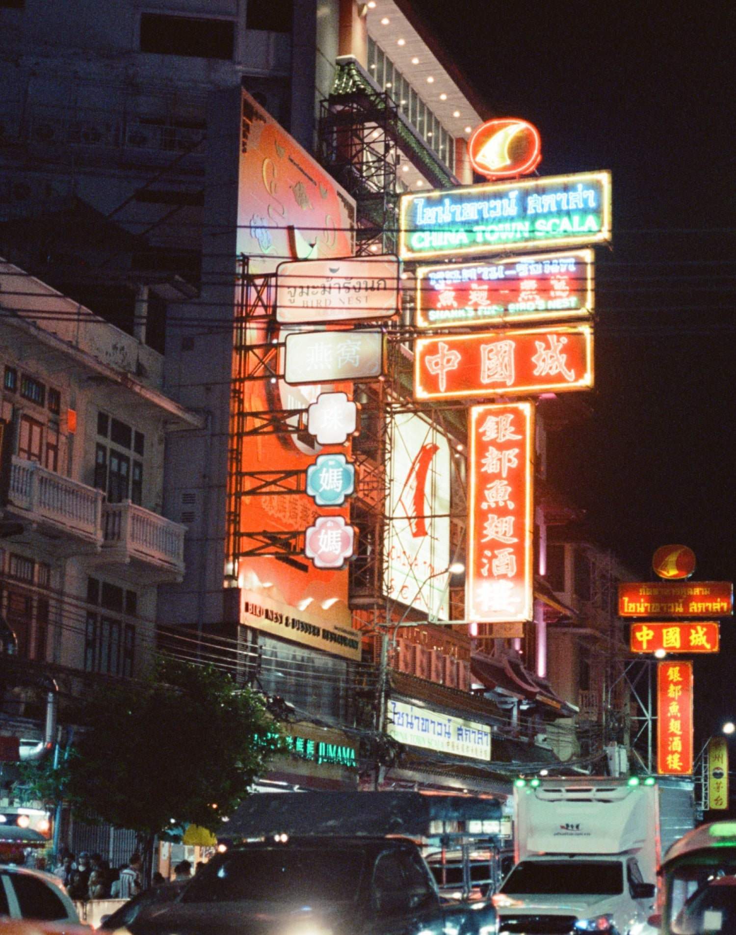 MISO 400 film capturing vibrant neon signs in Bangkok's Chinatown at night, showcasing the lively atmosphere of the city.