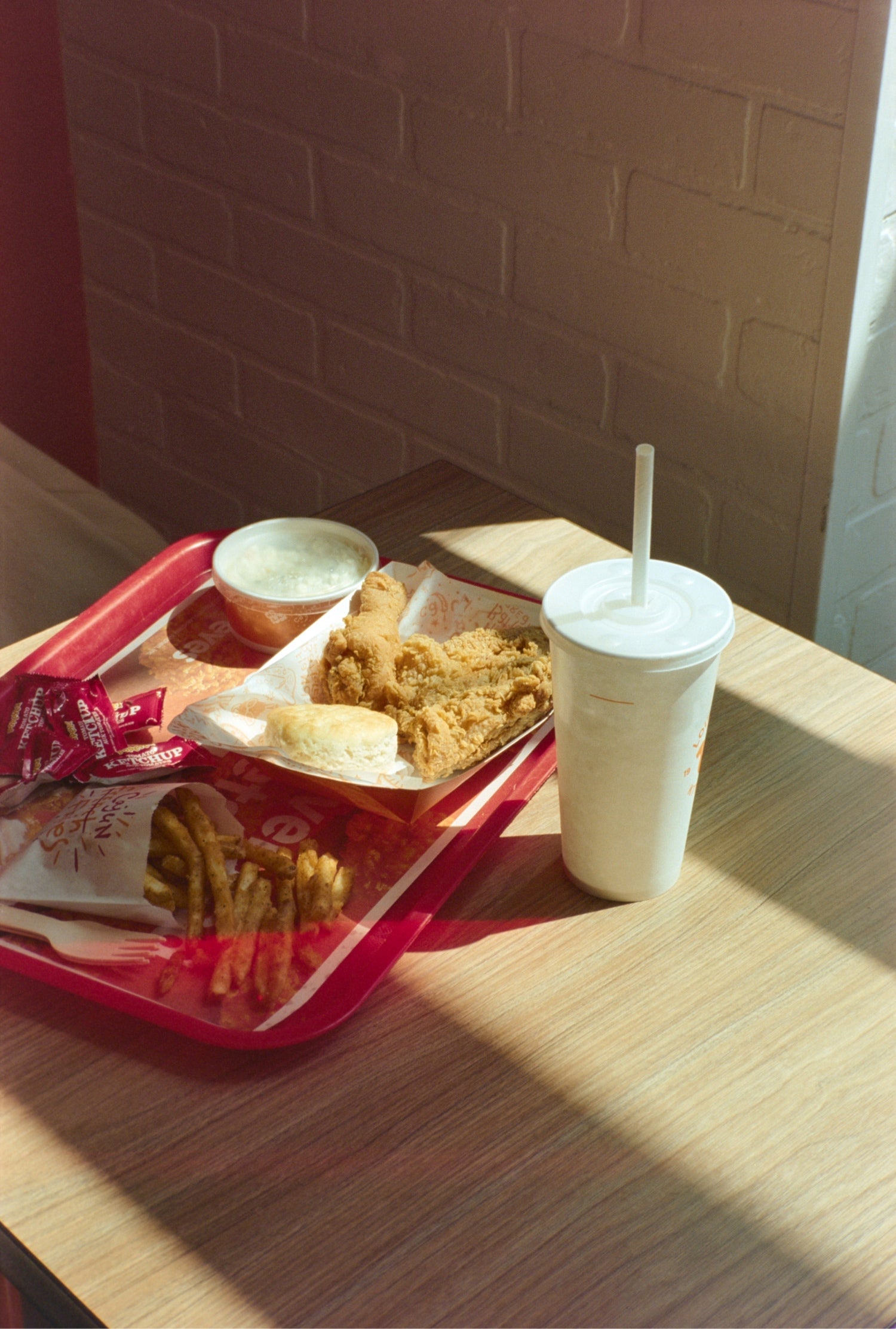 Fast food meal on a tray inside restaurant shot on MISO 200 film with medium grain