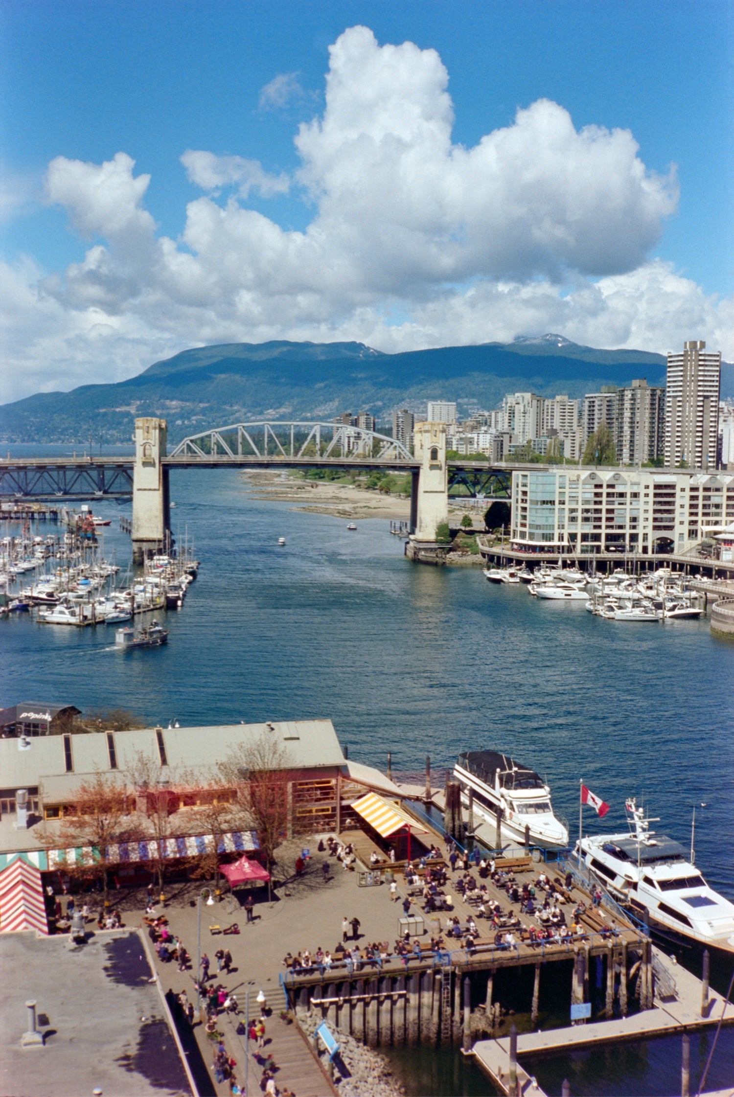 Scenic harbor view with boats shot on MISO 200 film with medium grain