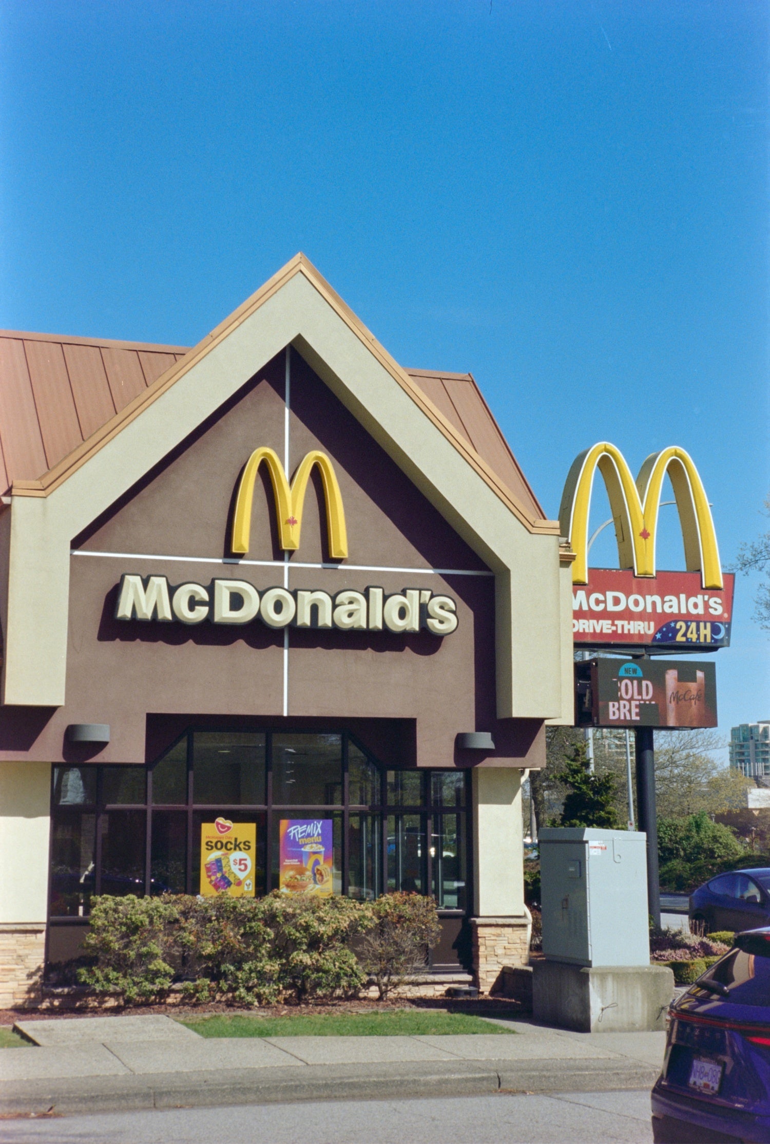 McDonald's restaurant with clear blue sky shot on MISO 200 film with medium grain